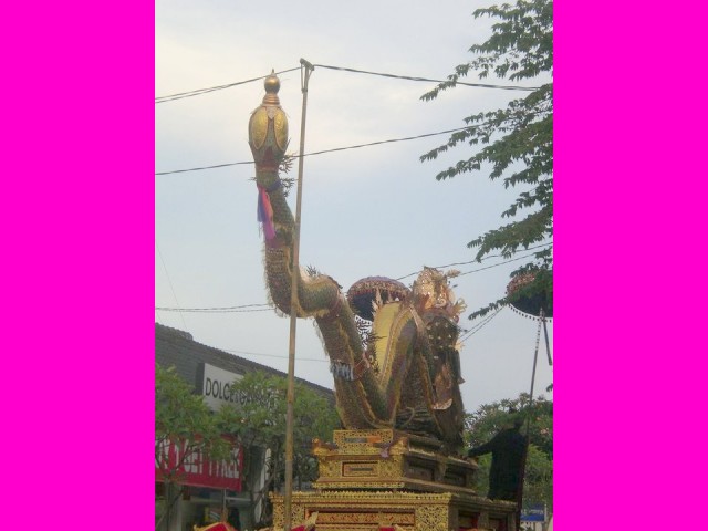 The procession's dragon was so tall, that the power lines had to be moved so it could pass by.